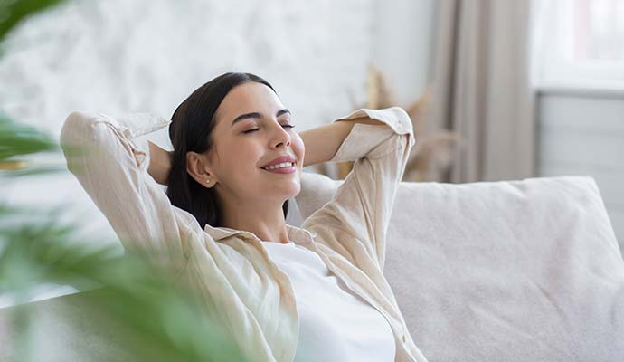 A person is enjoying improved indoor air quality A person is enjoying improved indoor air quality