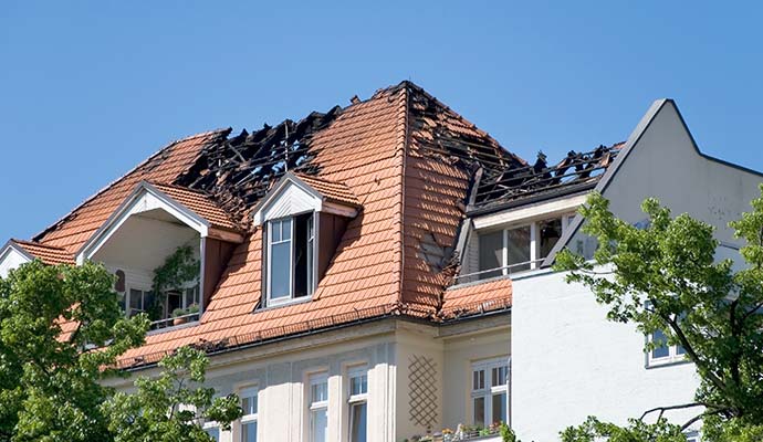 Fire damaged roof of a house Fire damaged roof of a house